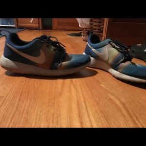 Multi colored Nike sneakers, worn